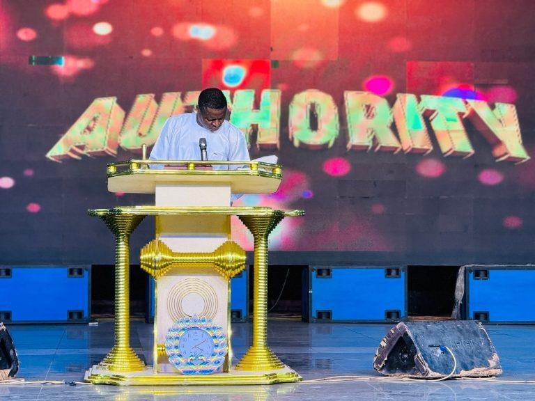 Prophet Samuel Adebayo Ojo decreeing at the golden altar with AUTHORITY backdrop